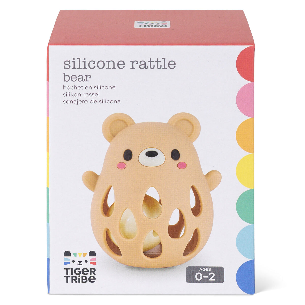 Tiger Tribe Silicone Rattle Bear in its original packaging, featuring a cute bear-shaped silicone rattle toy in a warm beige color with colorful rainbow accents on the box.