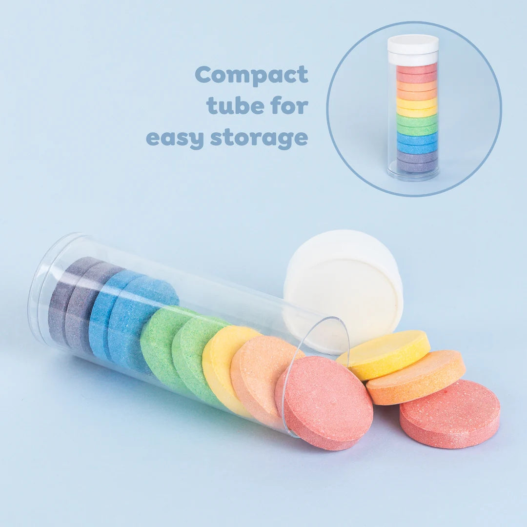 A boxed set of colorful bath fizzers shown in retail packaging on a white background. The package is blue with a clear window revealing stacked pastel bath salts in peach, yellow, green, blue, gray, and pink.