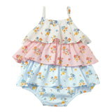 A three-tier baby romper with a colorful floral print, featuring ruffled layers in white, pink, and light blue, with thin shoulder straps, shown against a solid light gray background.