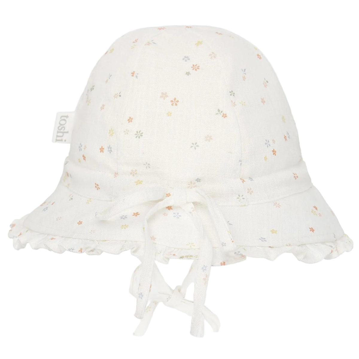 An off-white cotton bell baby bucket hat with a delicate multicolor floral print, featuring a ruffled brim, tie details, and a small side tag that reads 'baba+bi'.