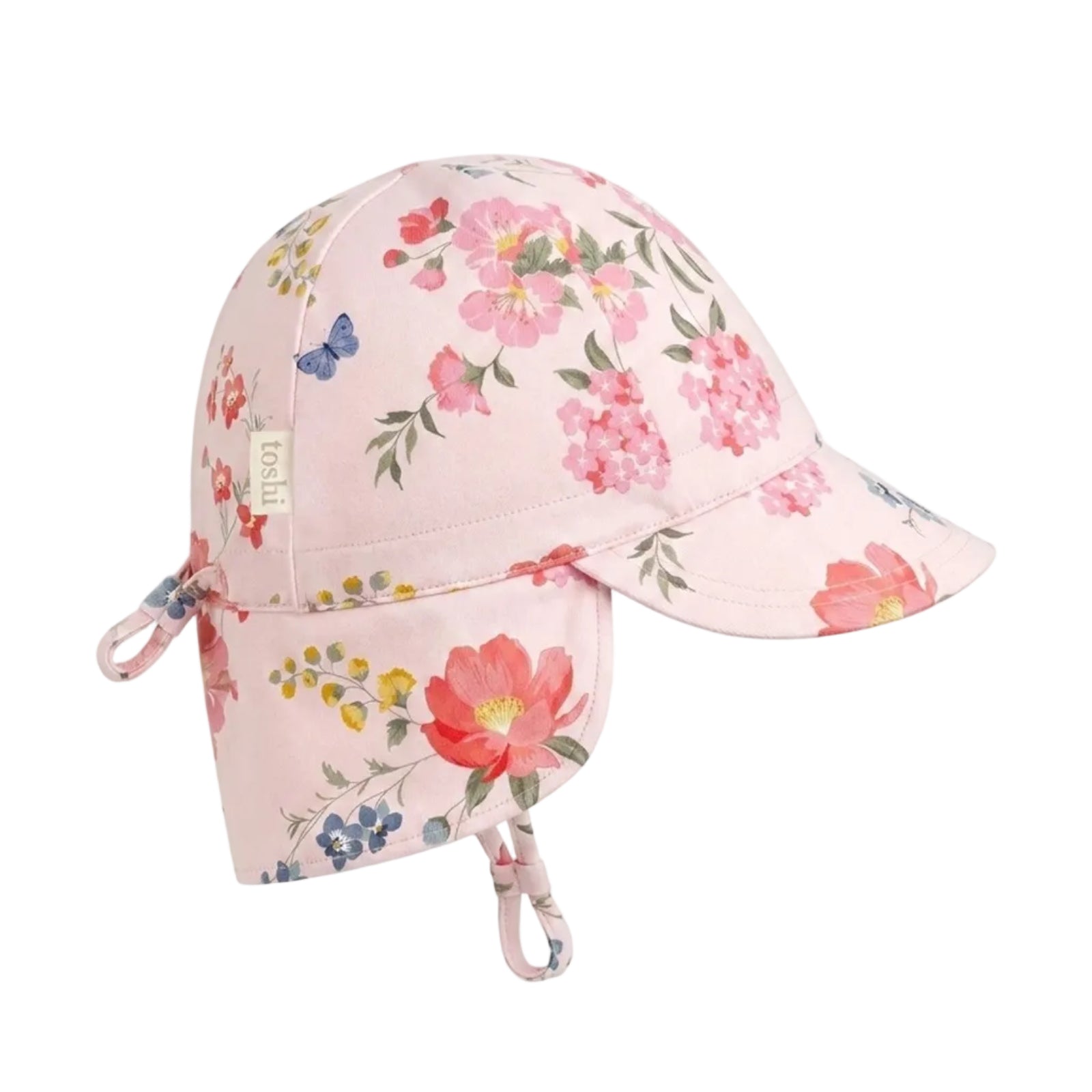 A light pink sun hat with a floral print, featuring a chin strap, ear loops, and a small fabric brand tag on the side, set against a plain light gray background.