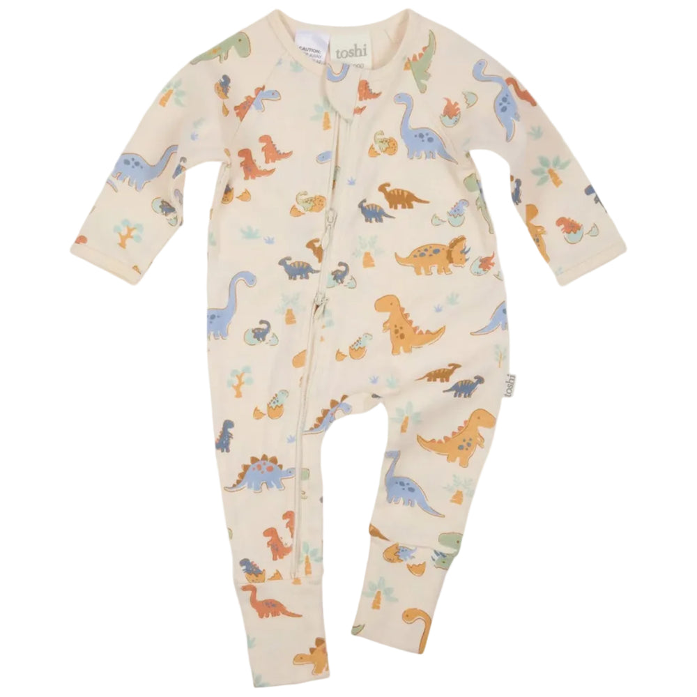 Baby onesie with dinosaur pattern on a white background