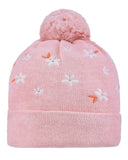 Pink knit beanie with floral patterns and a pom-pom on a light gray background