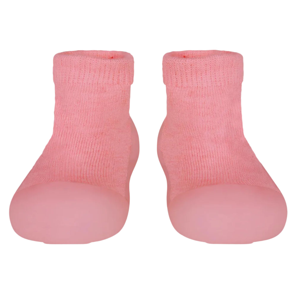 Pair of pink baby socks on a light gray background