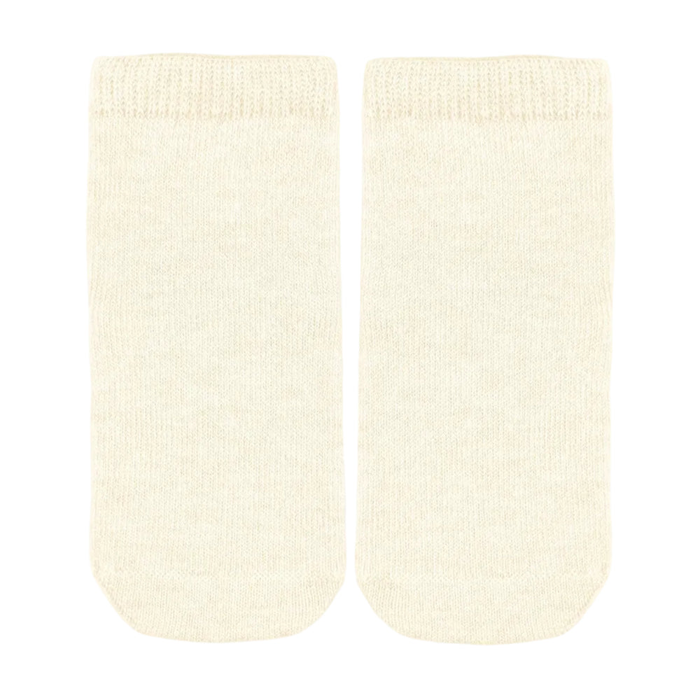 A pair of cream-colored ankle  baby socks with a ribbed knit cuff and toe, displayed flat against a light gray background.