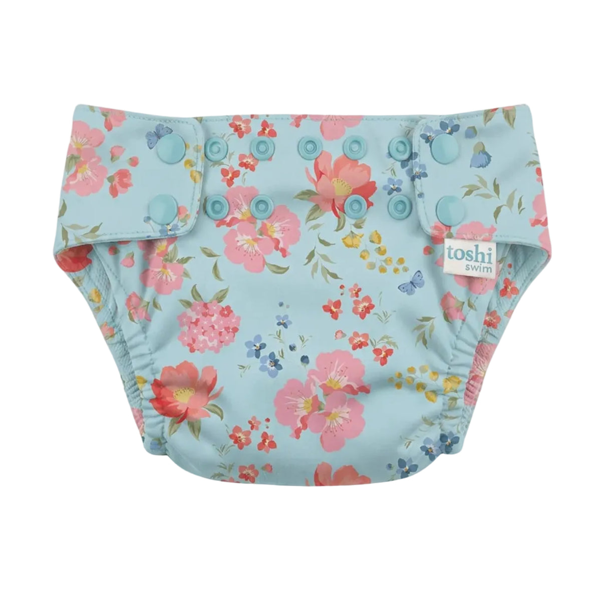 A reusable cloth swim nappy with a light blue background and a colorful floral print, featuring snap-button closures and a small 'loshi' brand tag on the side.
