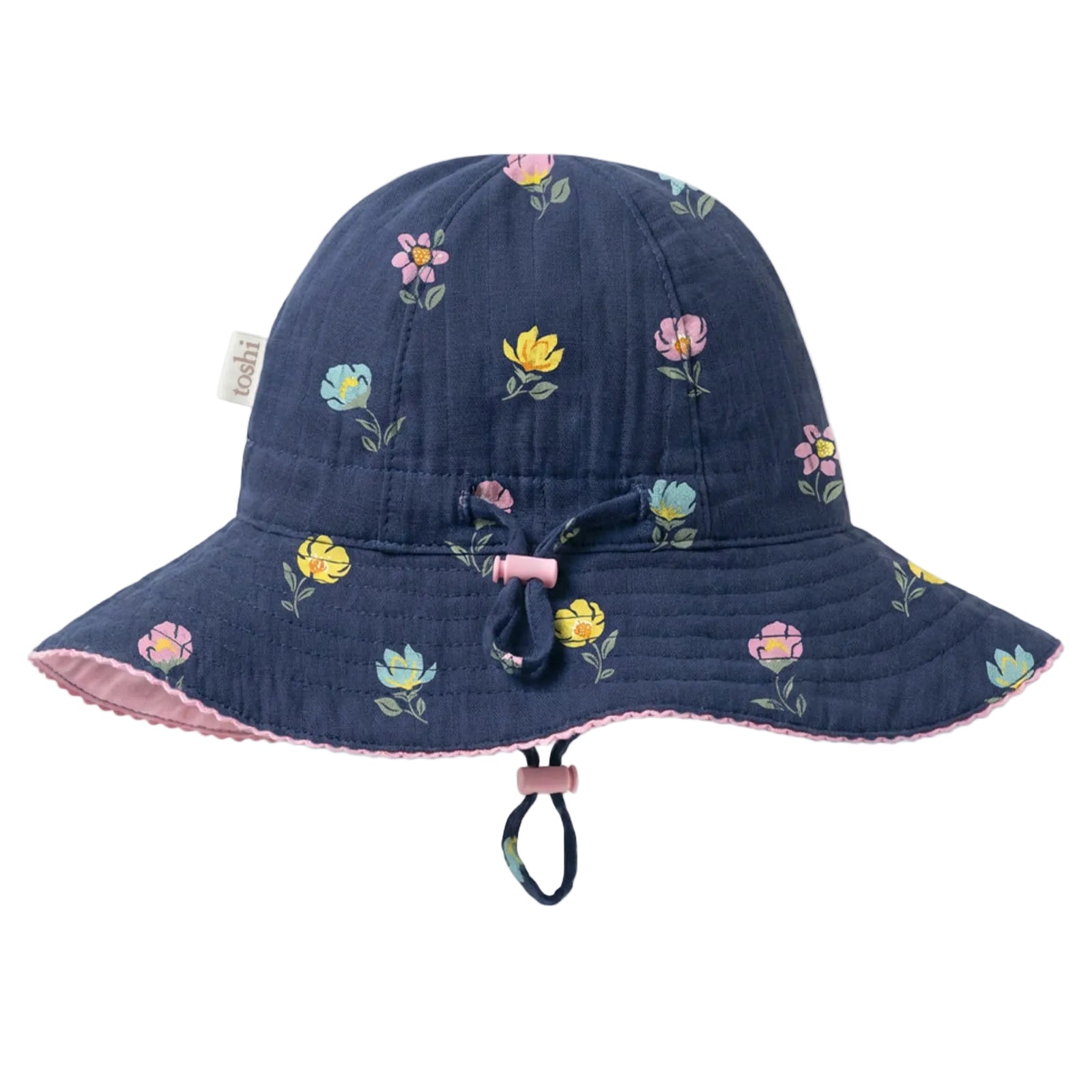 A navy blue quilted bucket hat with a colorful floral print, featuring a pink chin strap and a small fabric brand tag on the side.