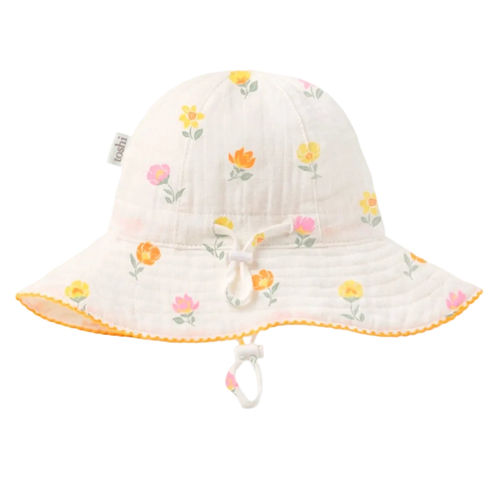 A white cotton bucket hat for babies, featuring a colorful floral print in yellow, orange, and pink, with a matching white chin strap and yellow trim on the brim.