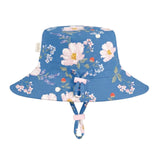 A blue bucket hat with a floral print featuring white, pink, and blue flowers, shown against a plain light gray background.