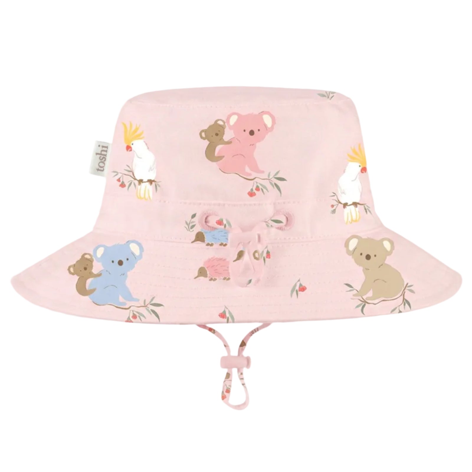 A light pink bucket hat for children, featuring a playful cartoon animal print of koalas, a pink kangaroo, a blue koala, a pink kangaroo, and white cockatoos. The hat has a chin strap with a pink and white patterned loop, shown against a solid light gray background.