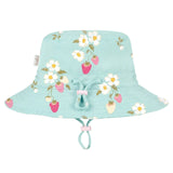 A light blue girls bucket hat with a strawberry and daisy floral print, featuring a drawstring chin strap, shown against a light gray background.