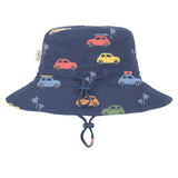 A navy blue bucket hat for kids, featuring a playful print of colorful vintage cars and white palm trees, complete with a matching navy blue chin strap.