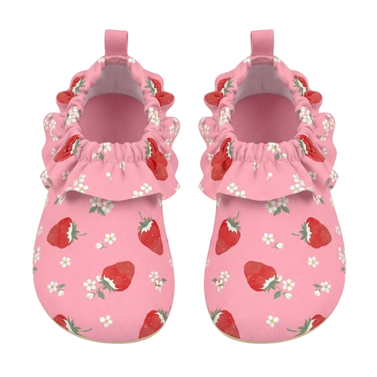 A pair of pink baby mule style swim shoes with a strawberry and white flower print, featuring ruffled trim around the open back and pull tabs, shown on a light gray background.