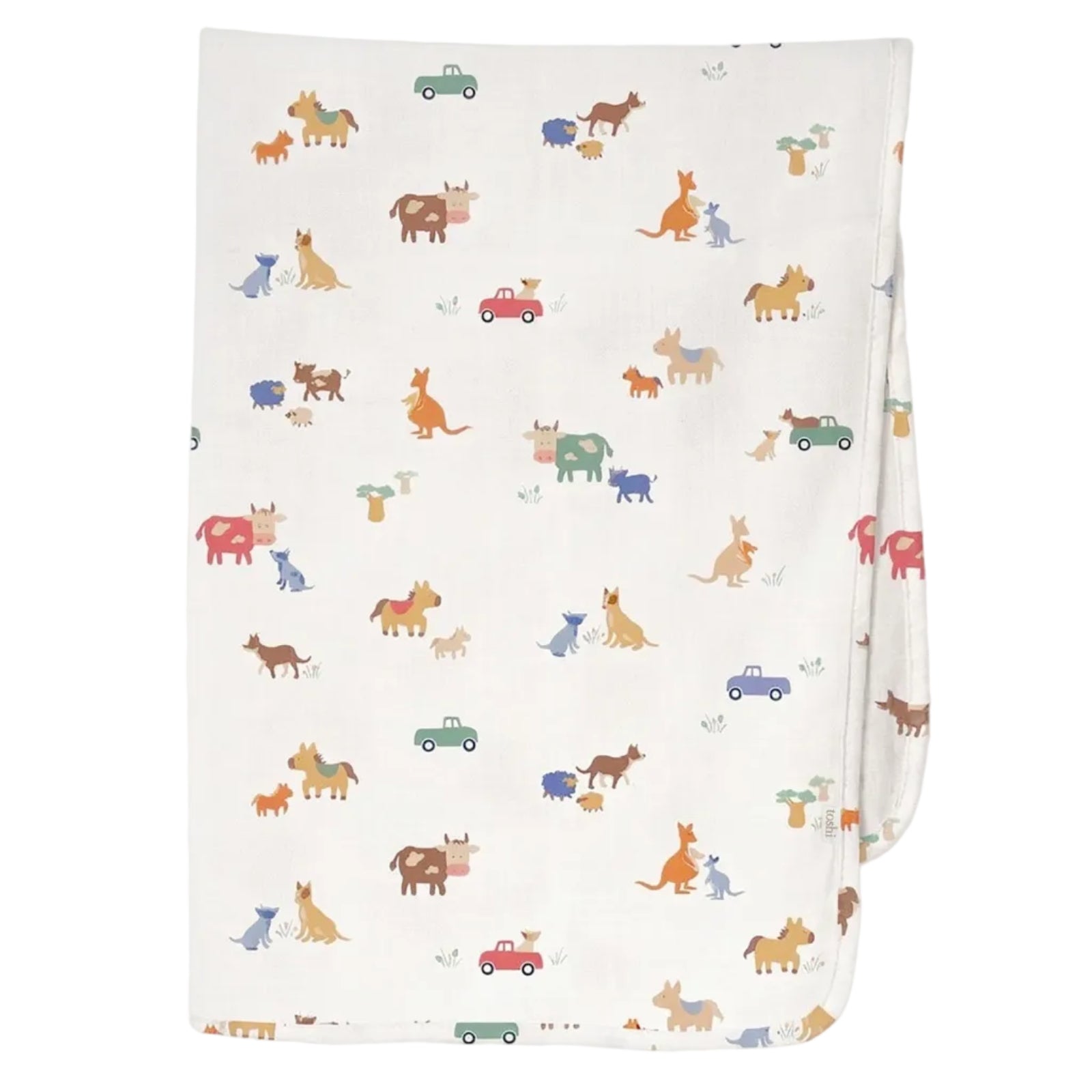 A folded white muslin blanket featuring a colorful cartoon animal print of dogs, cats, kangaroos, and small cars, shown against a light gray background.