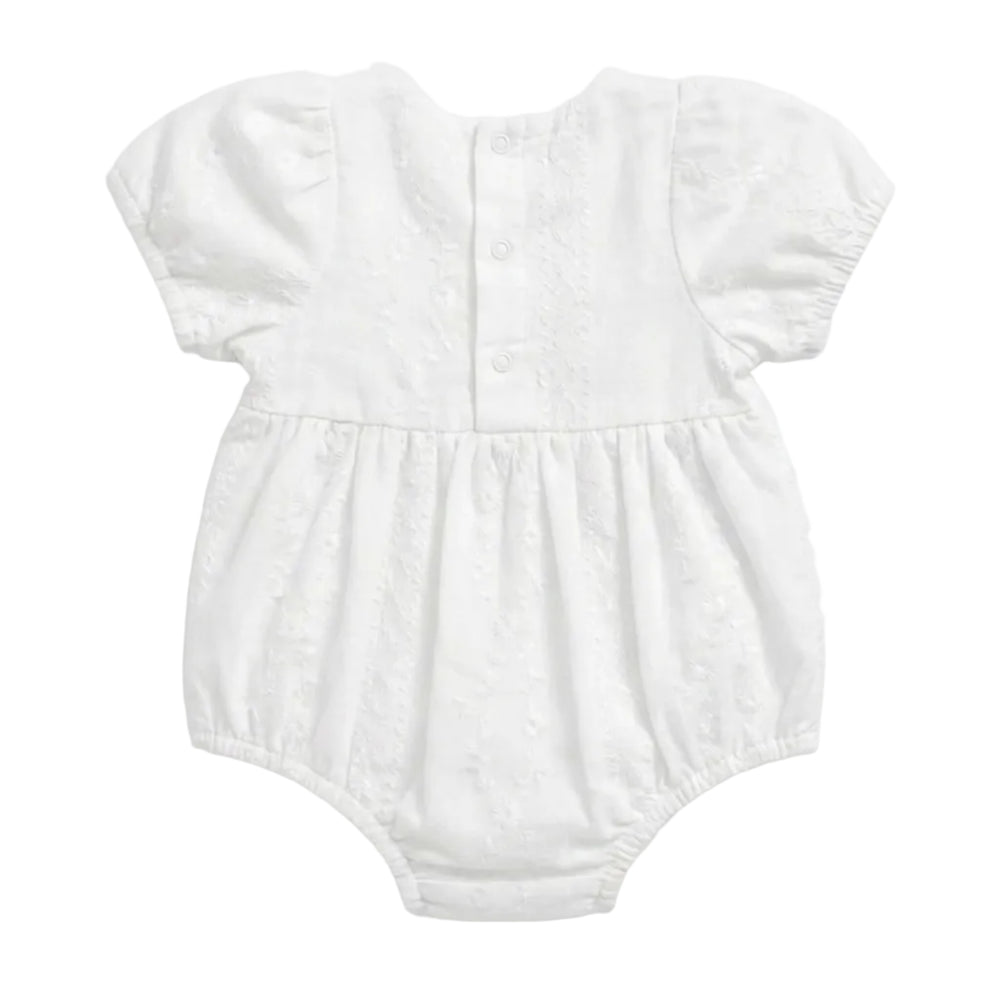 A white short-sleeve baby romper with puff sleeves, a buttoned back, and a gathered waist, shown flat on a light gray background.