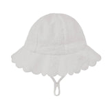 A white toshi bell sun hat for children, featuring a scalloped lace brim and a chin strap, shown against a light gray background.