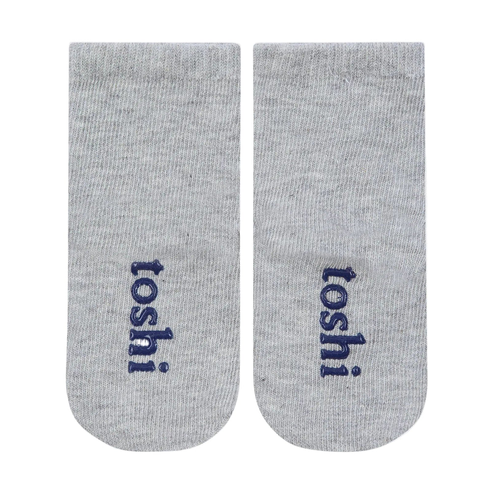 Two gray socks with 'toshi' branding on a white background