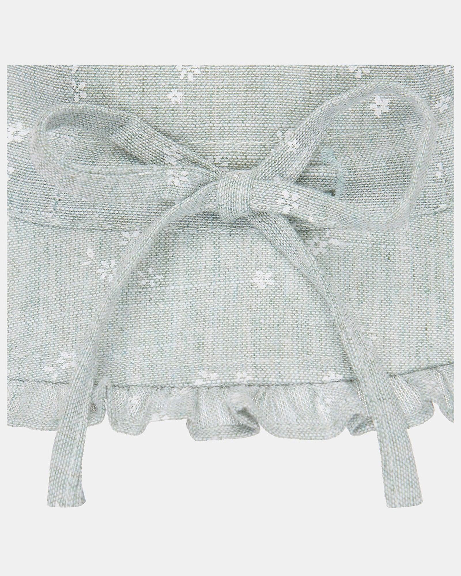 Light gray baby bonnet with floral pattern and bow on a white background
