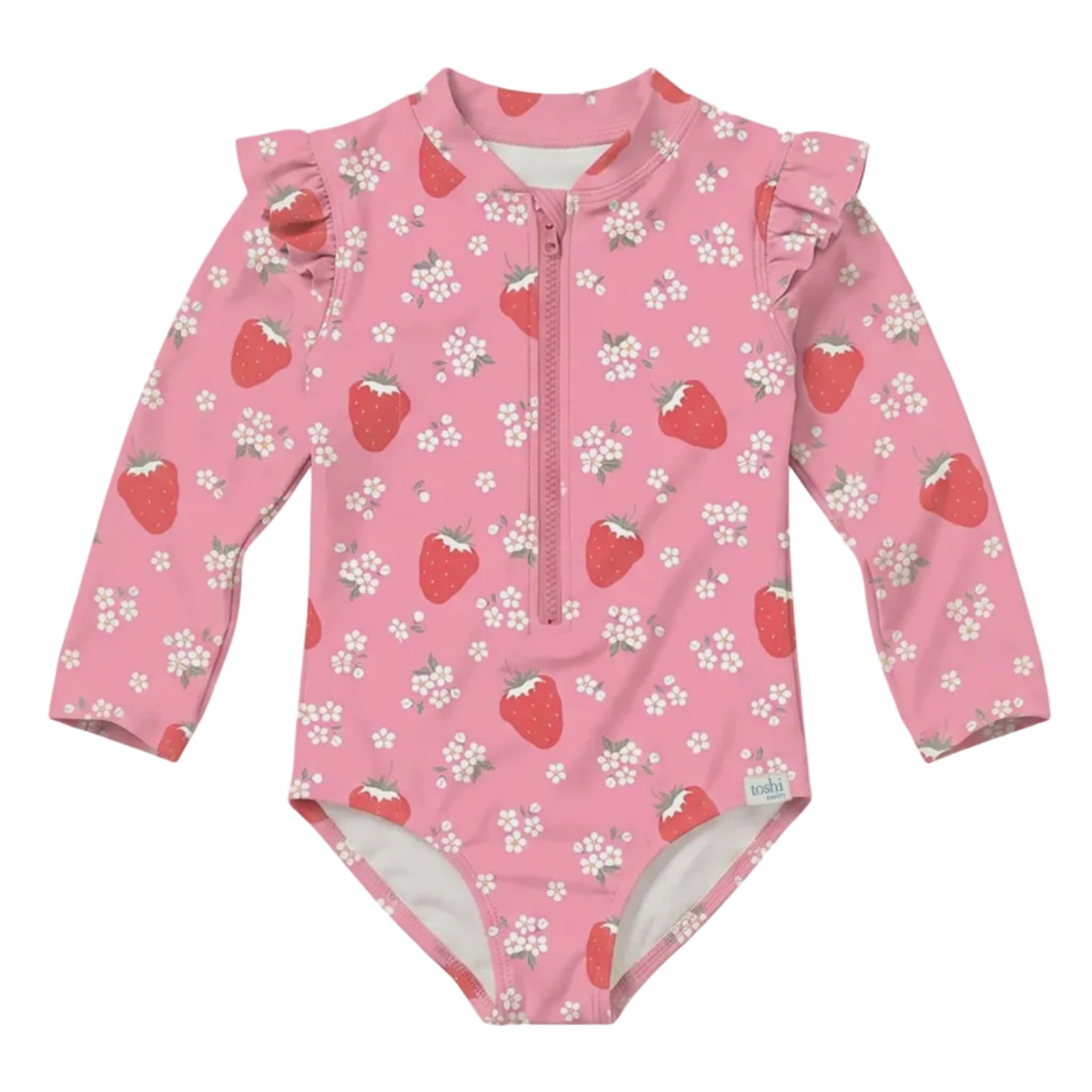A pink long-sleeve baby swimsuit with a front zipper, ruffled shoulder details, and an all-over strawberry and white flower print, shown against a solid light gray background.