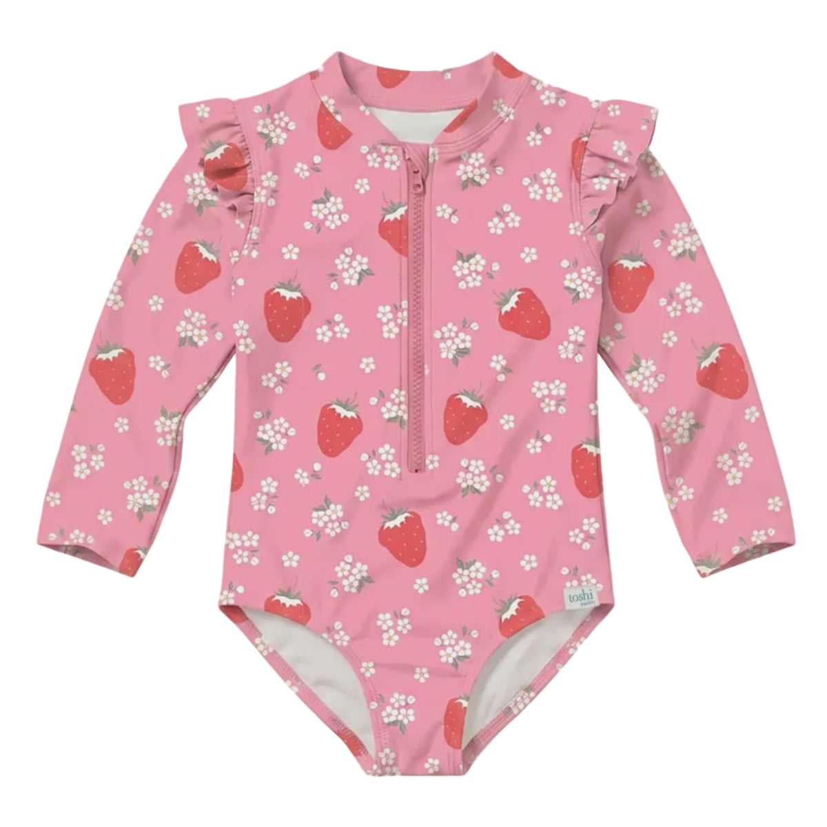 A pink long-sleeve baby swimsuit with a front zipper, ruffled shoulder details, and an all-over strawberry and white flower print, shown against a solid light gray background.