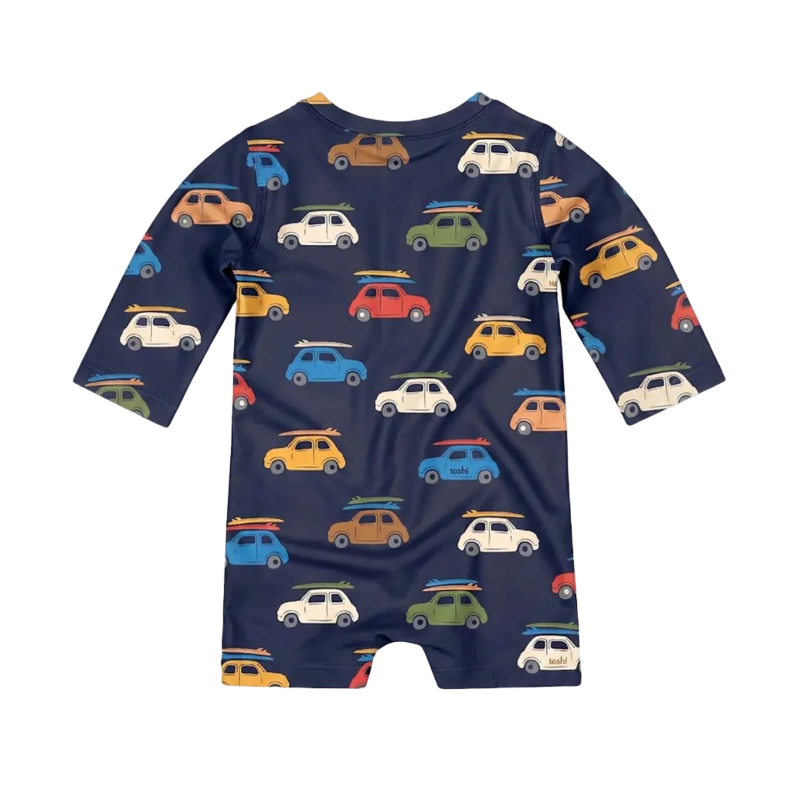 A long-sleeve baby romper in navy blue with an all-over pattern of colorful vintage cars and surfboards, shown against a light gray background.
