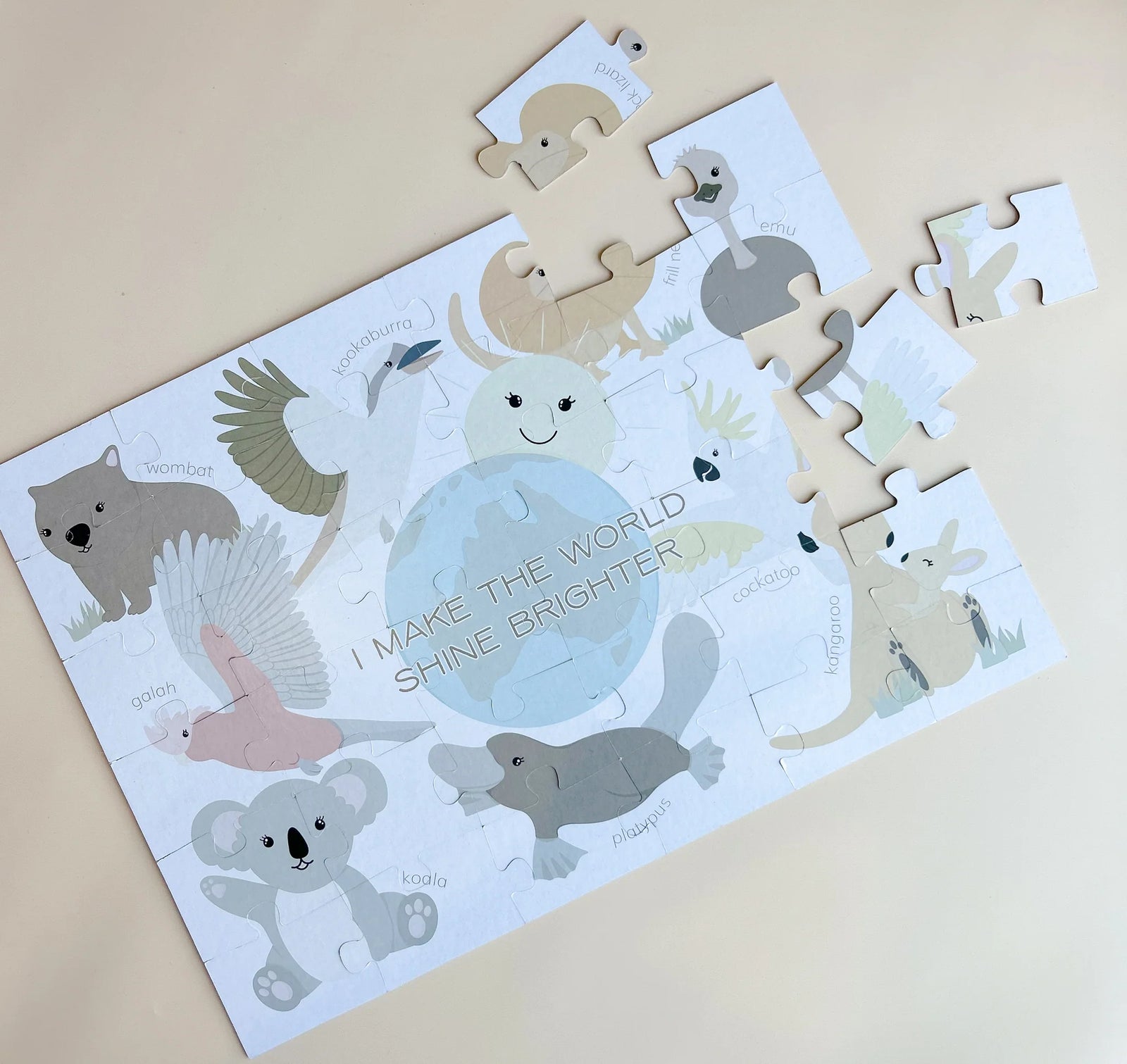 Children's puzzle with aussie animal illustrations on a beige background