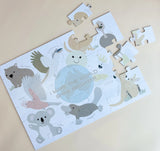 Children's puzzle with aussie animal illustrations on a beige background