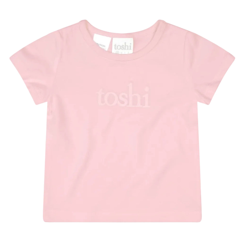 Pink t-shirt with 'toshi' branding on a light gray background