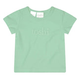 Light green t-shirt with 'toshi' branding on a white background
