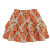 A mid-thigh length beige skirt with a crayon effect spades print, featuring an elasticated waistband and a functional drawcord.